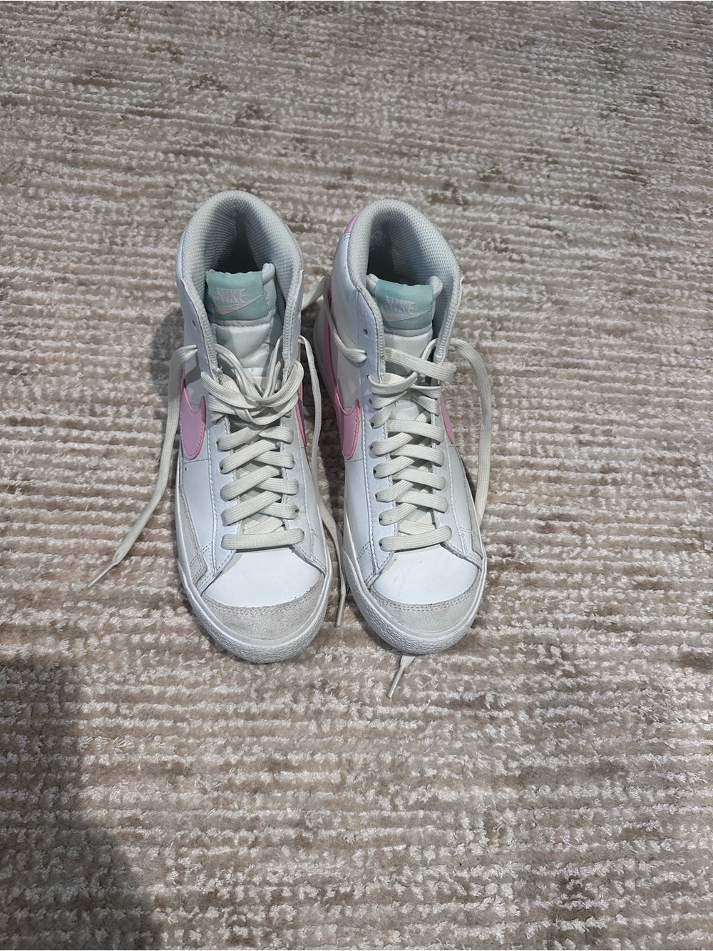 Nike Kids High-Top Sneakers in White with Pink Swoosh